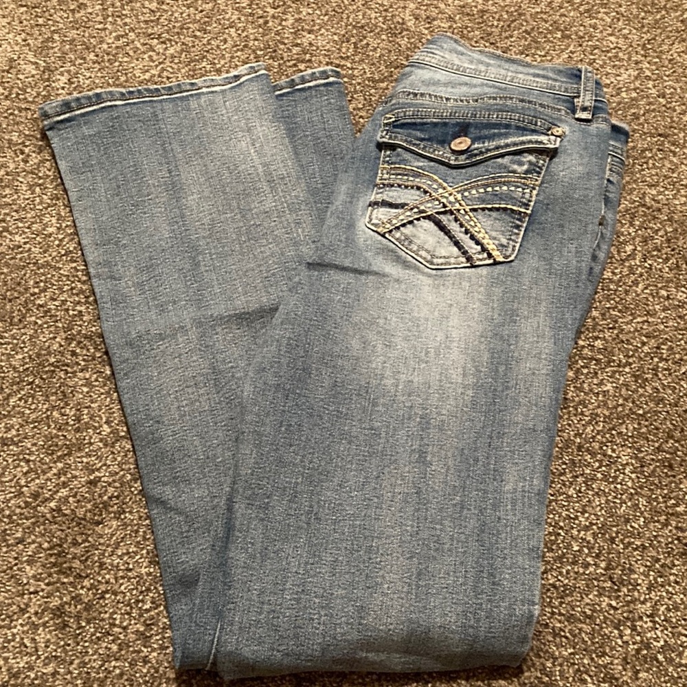Blue Boot Cut Jeans with Distressed Details